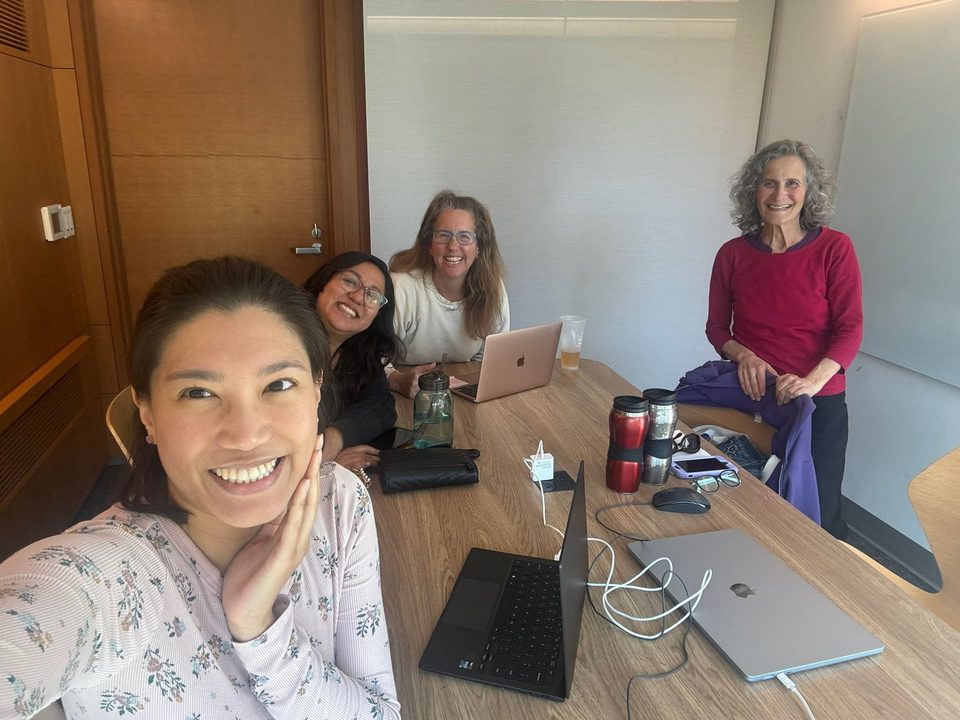 Kafenia staff Karla, Rose, Mary Jane and Barbara working together around a table, May 2025